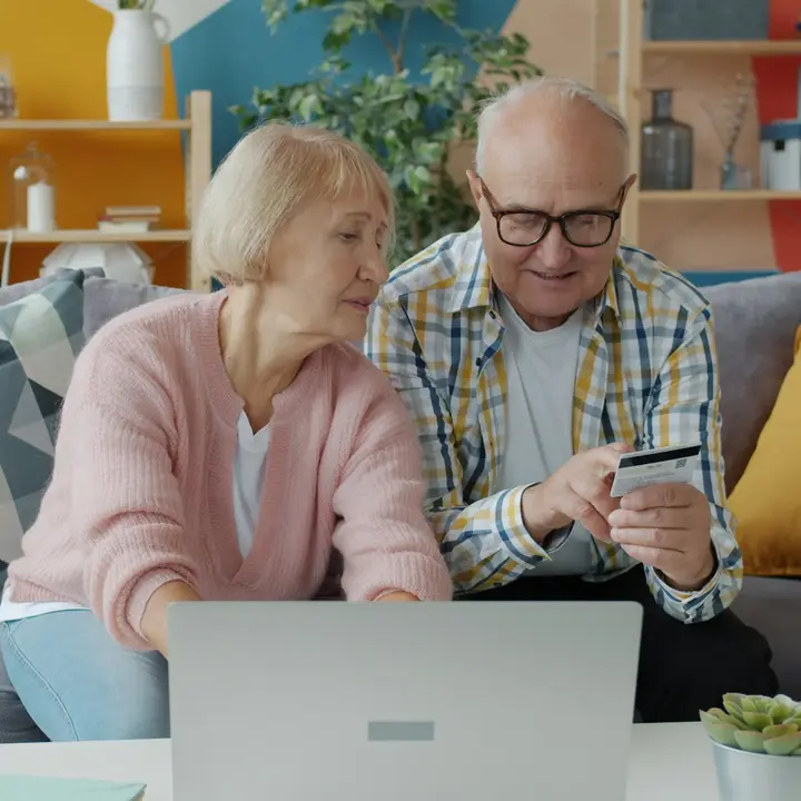 Couple paying for an online order on a laptop, the moment a conversion is recorded