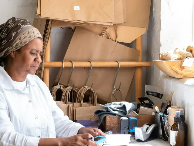 Owner preparing online orders at her studio desk