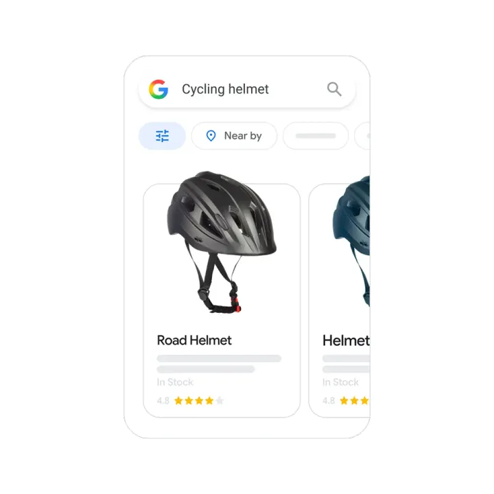 Google illustration of a phone search for cycling helmet with Shopping ads showing helmet photos, stock status and star ratings