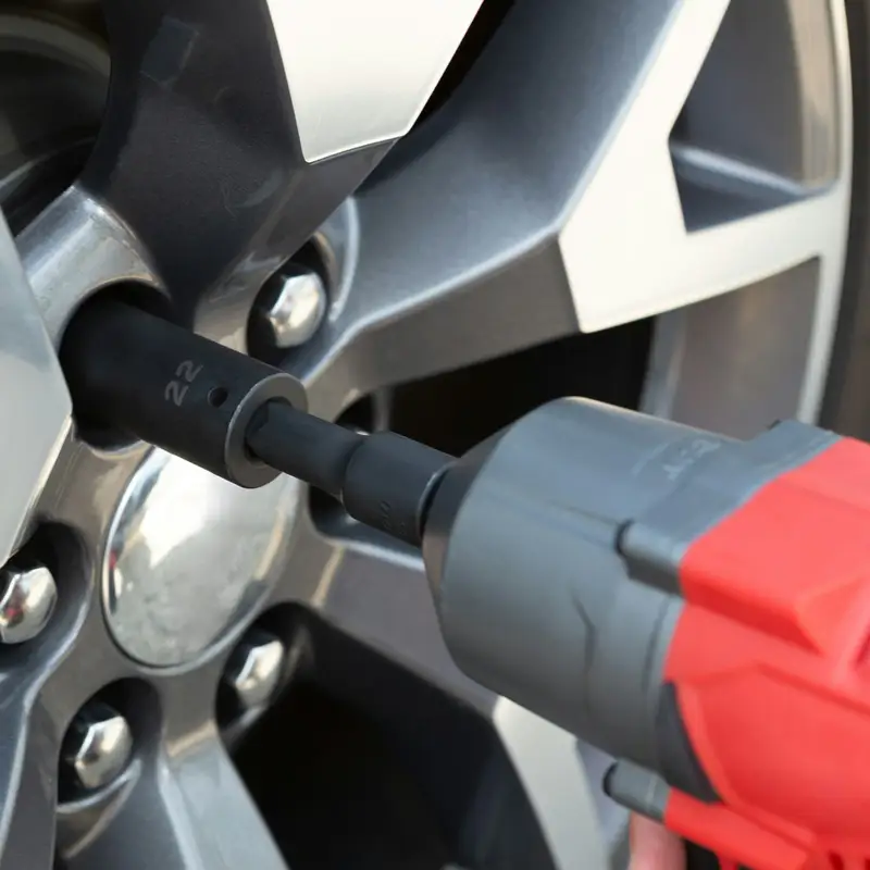 Email header photo: an impact wrench tightening the lug nuts on a silver alloy wheel