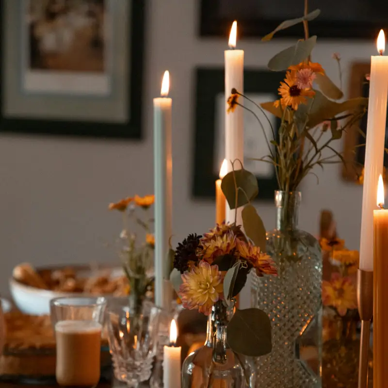 Email header photo: brunch table set with candles, flowers, juice and waffles with strawberries