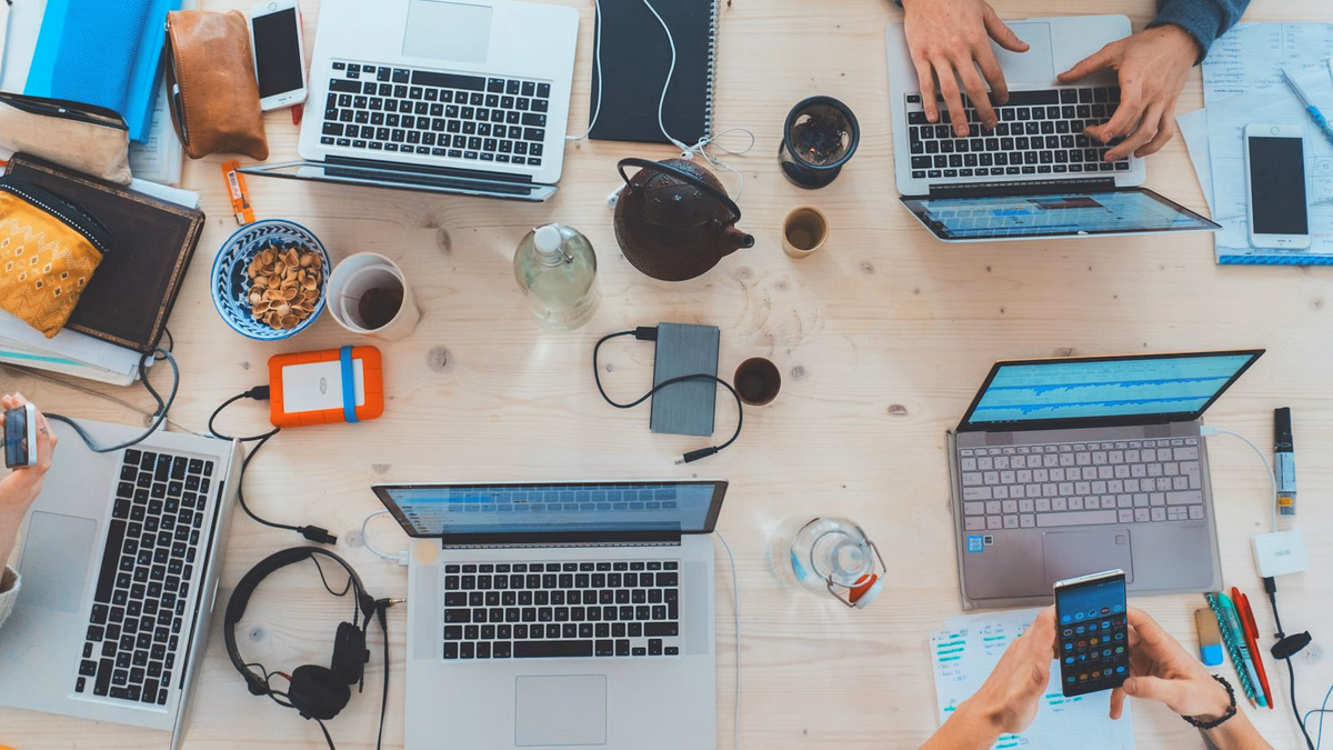 B2B SaaS product manager analyzing revenue pipeline metrics on a laptop in modern office