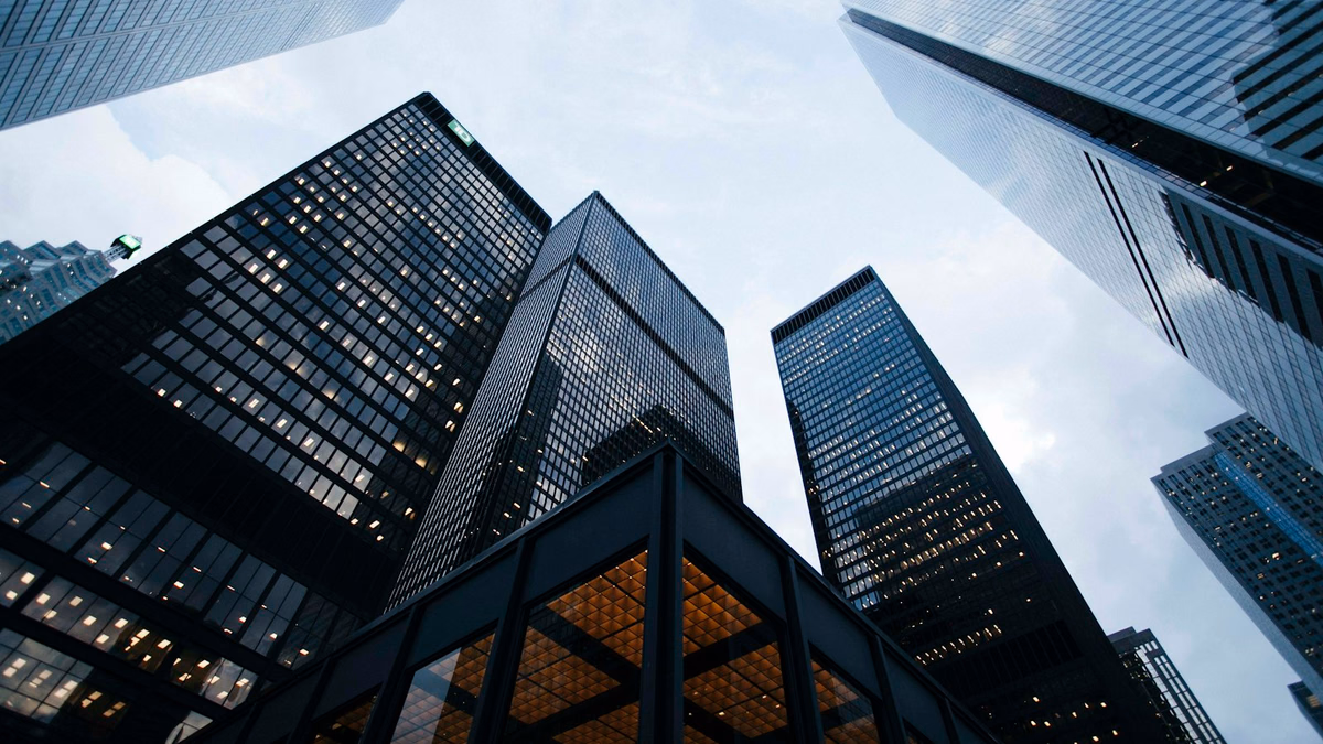 Modern corporate headquarters and data engineering architecture illustrating commercial entity synchronization