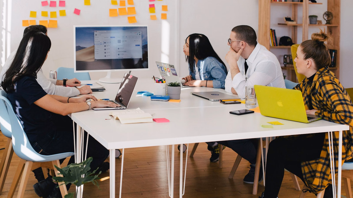 Digital marketing strategists analyzing search query reports and negative keyword matrix performance
