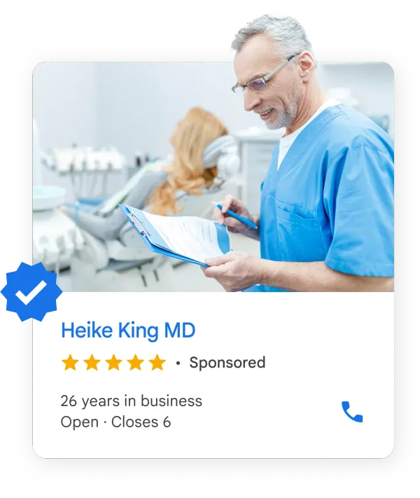 Dentist reviewing a chart beside a patient, above a Local Services ad card with the Google Verified badge