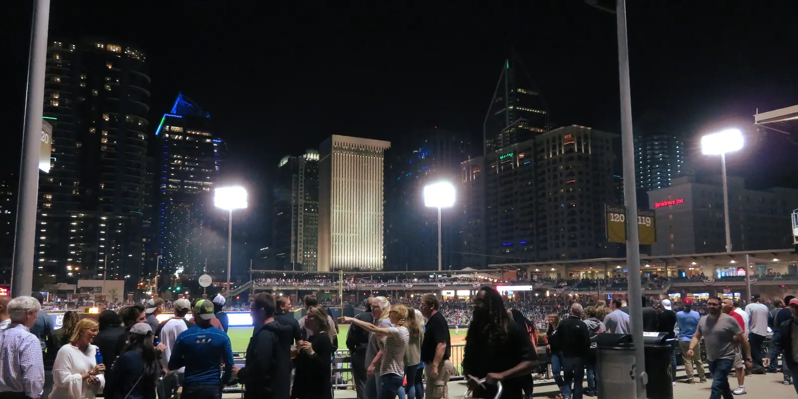 Charlotte Knights baseball game at Truist Field with the Uptown Charlotte skyline towering behind the outfield