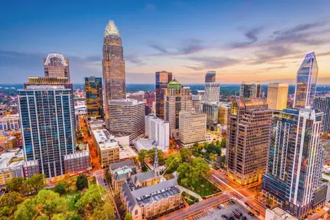 Aerial twilight view of the Uptown Charlotte skyline and corporate towers in North Carolina