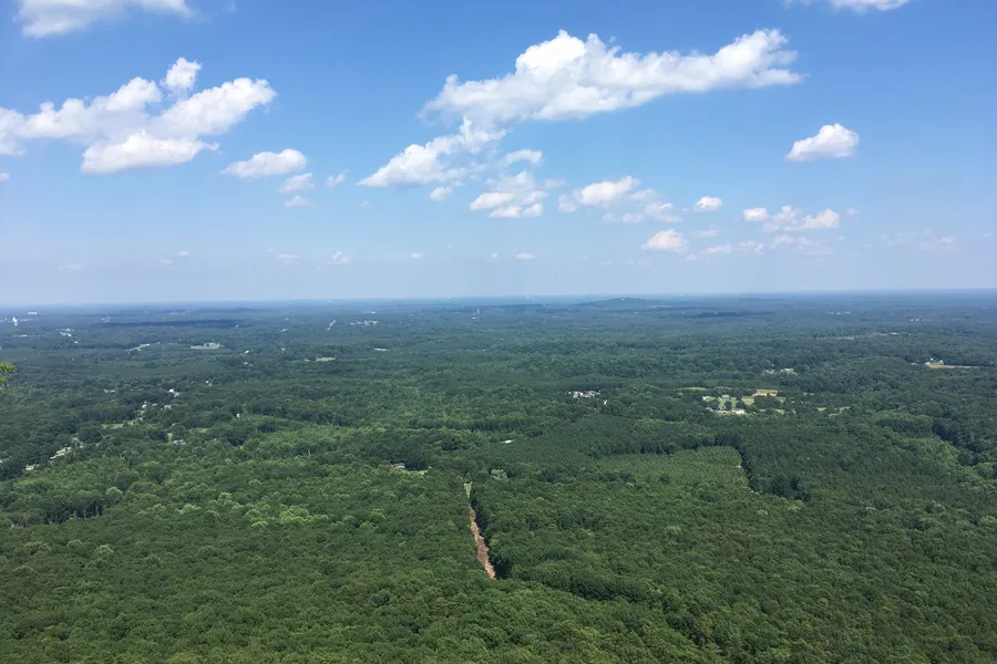 View looking east across the Piedmont toward Charlotte from the summit cliffs of Crowders Mountain