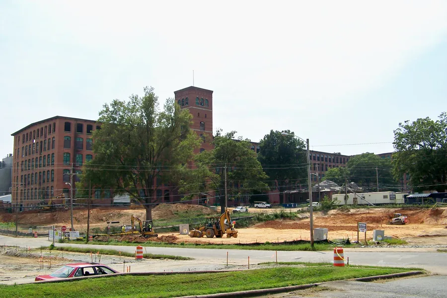 Historic brick exterior and signature clock tower of Loray Mill in Gastonia, North Carolina