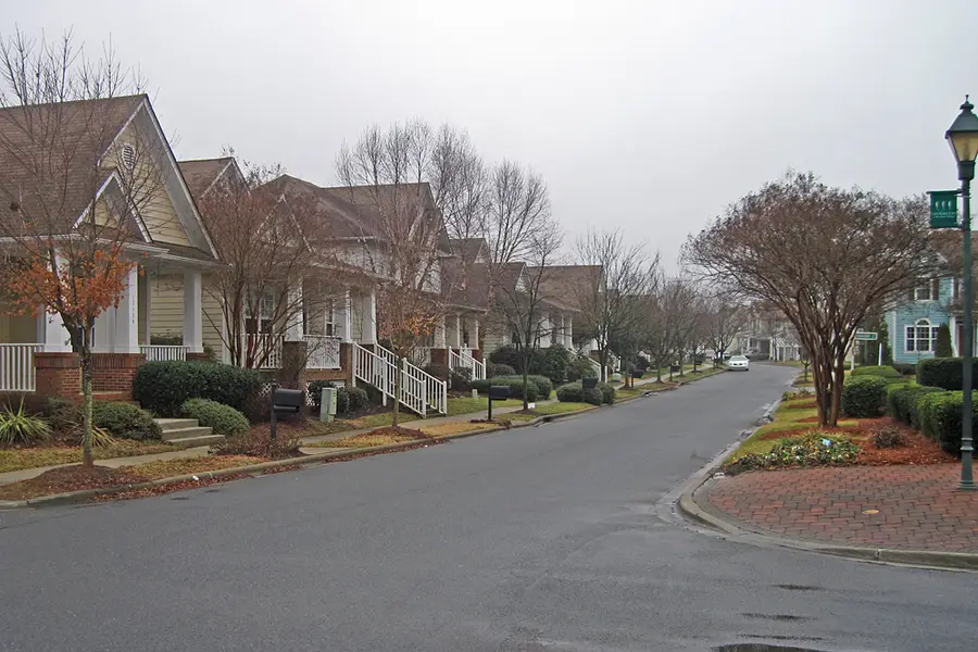 Bungalow-style homes facing a small park inside Birkdale Village in Huntersville, North Carolina