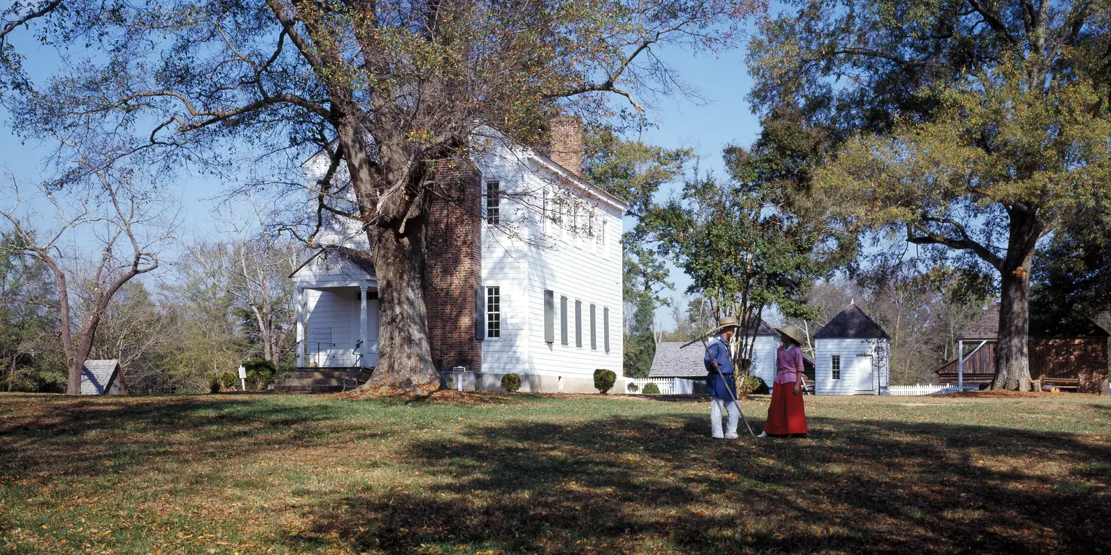 Costumed interpreters on the lawn of Latta Place during a living history program at Latta Nature Preserve in Huntersville