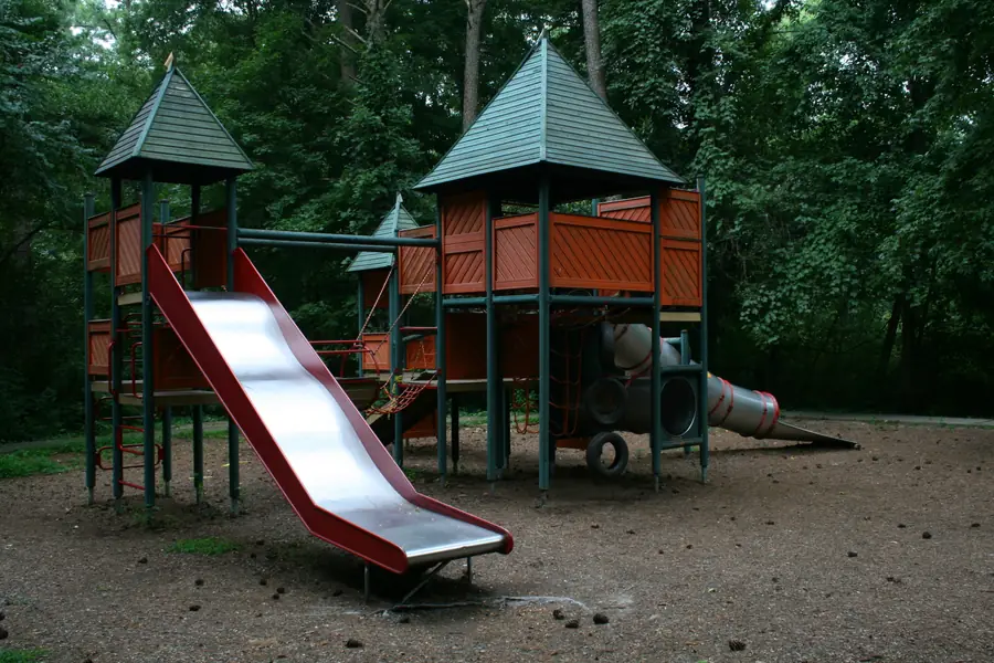 Playground structures, walking trails, and green open space at an Indian Trail municipal park in North Carolina