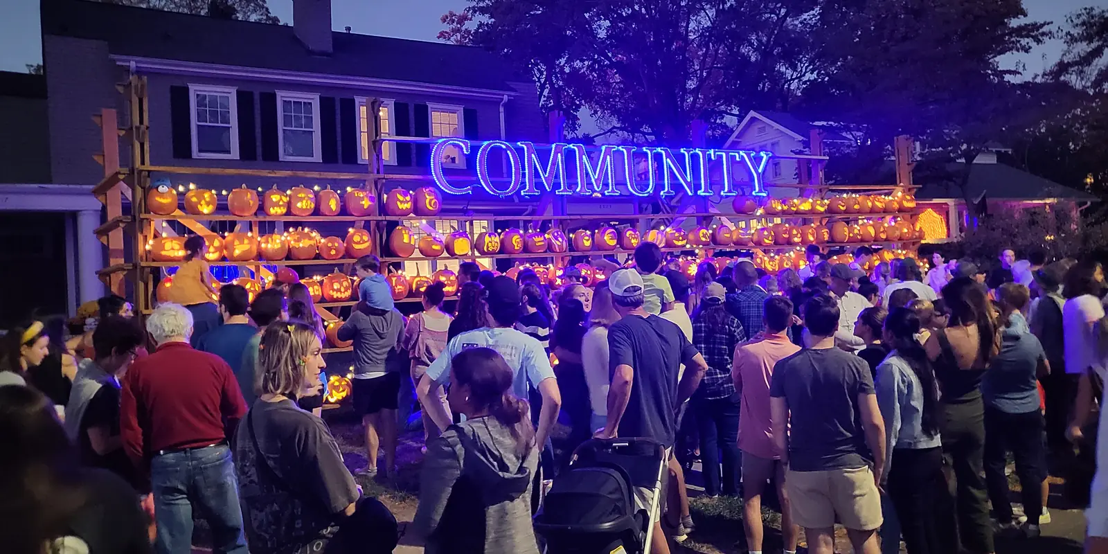 Illuminated festive decorative pumpkin display during an autumn community gathering in North Carolina