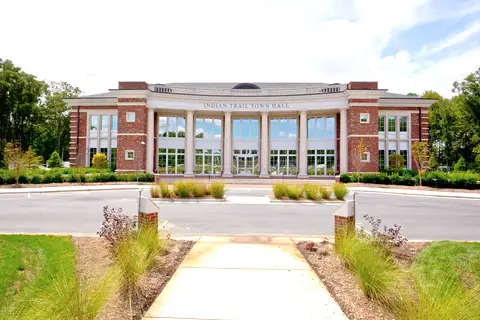 Exterior front entrance and brick portico of Indian Trail Town Hall in Union County, North Carolina