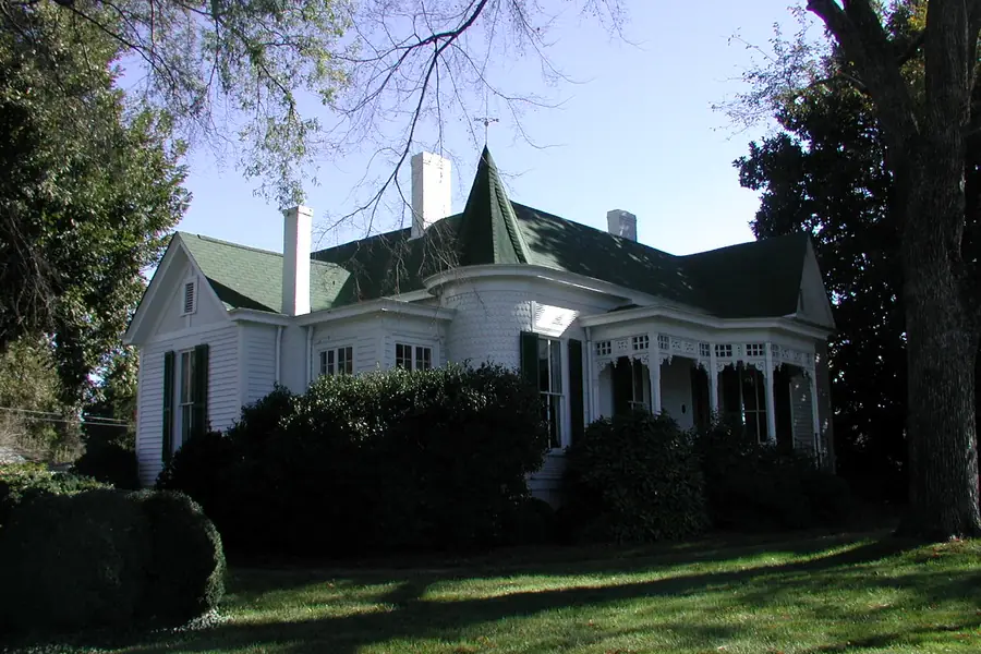Restored two-story Victorian architecture of the historic Reid House on West John Street in Matthews