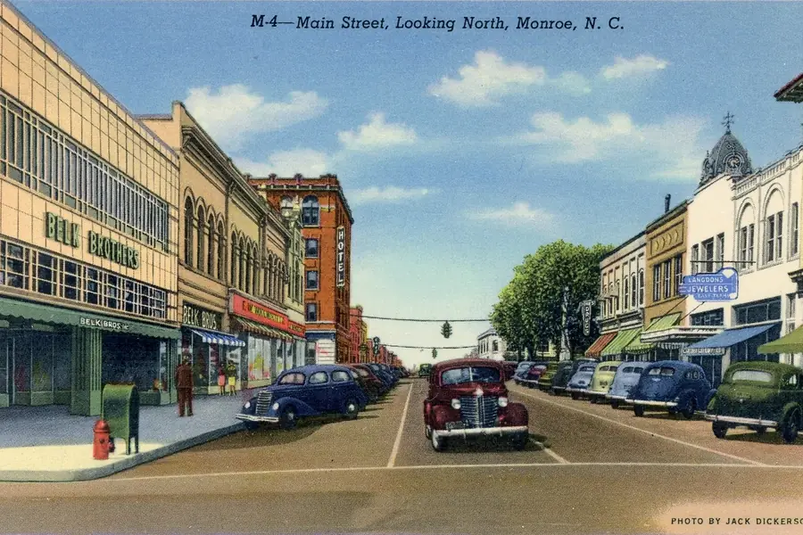 Historic postcard depicting the original Belk Brothers department store building on Main and Franklin streets in Monroe
