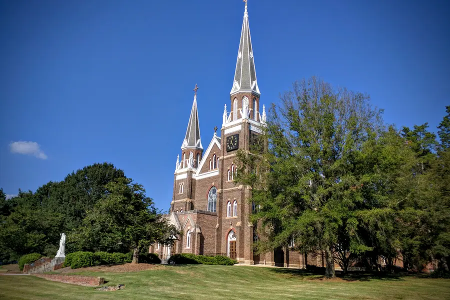 Gothic Revival twin-spire brick facade of Belmont Abbey Cathedral Basilica in Belmont, North Carolina