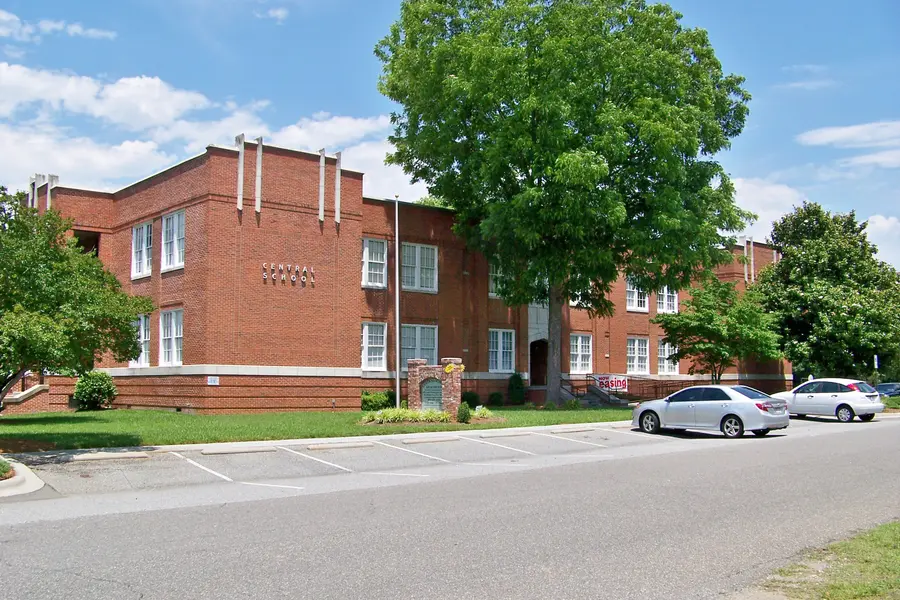 Historic brick exterior and entrance of Bessemer City Central School in central Bessemer City