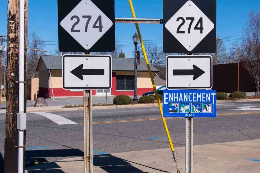 North Carolina Highway 161 and Highway 274 route markers at commercial thoroughfare in Bessemer City
