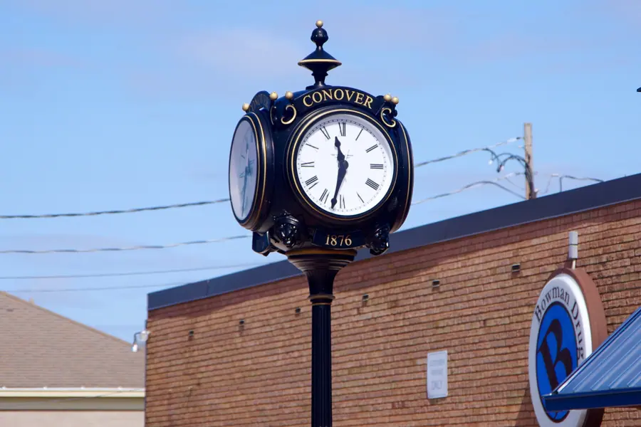 Traditional cast iron street clock standing in downtown Conover North Carolina