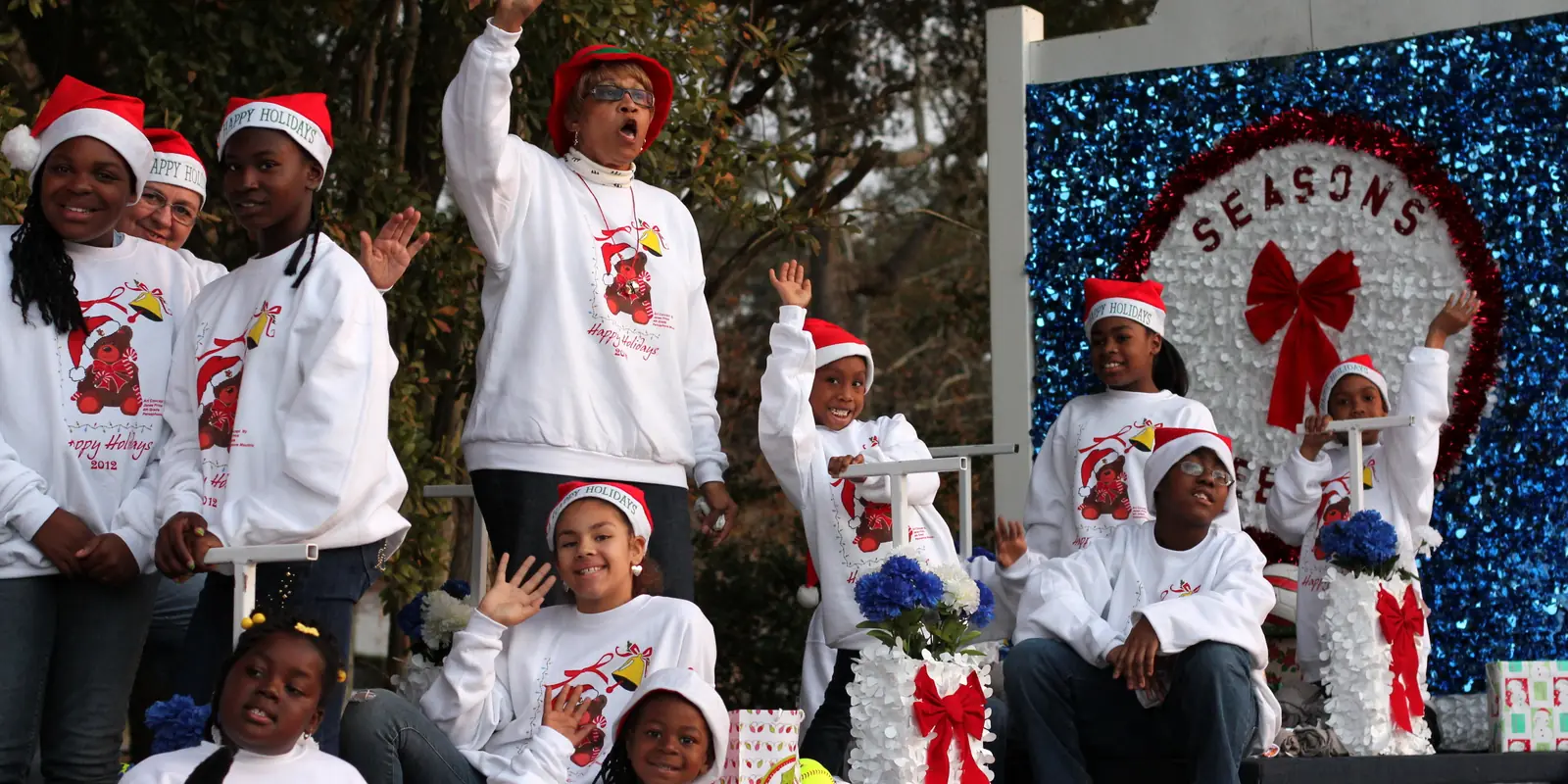 Festive community holiday gathering and evening lights parade in the Carolinas