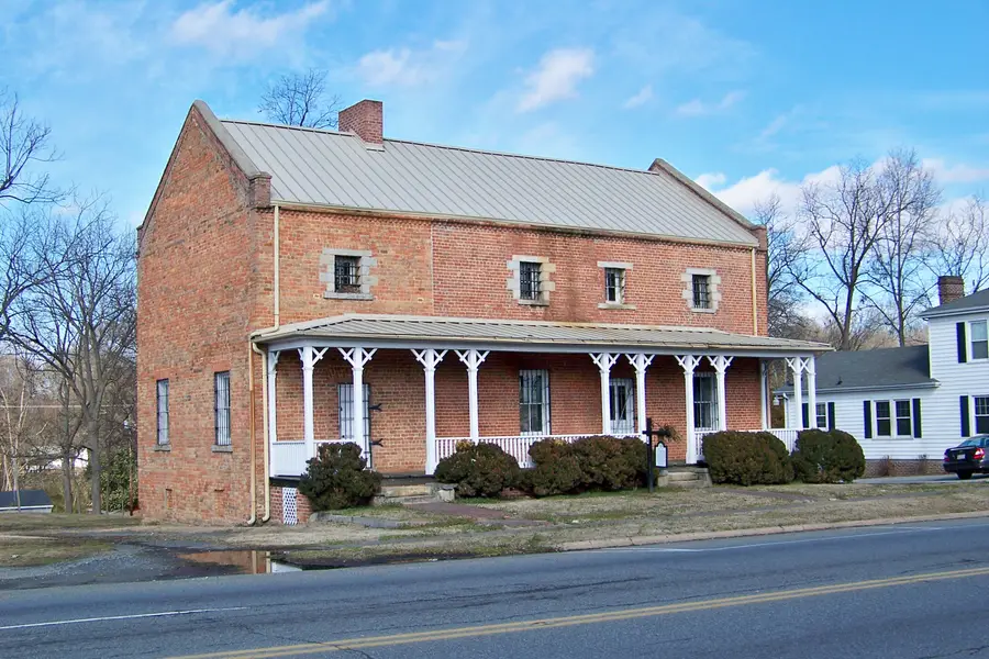 Stone and brick masonry facade of the historic 1848 Gaston County Jail in Dallas, North Carolina