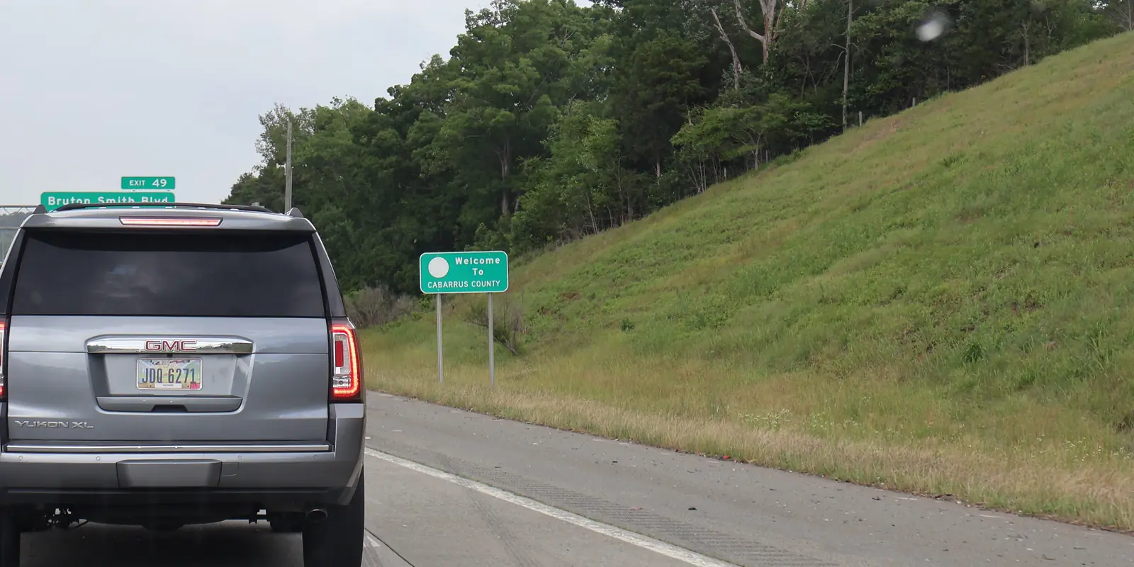 Interstate 85 highway sign at the Mecklenburg and Cabarrus county boundary connecting Charlotte to Harrisburg