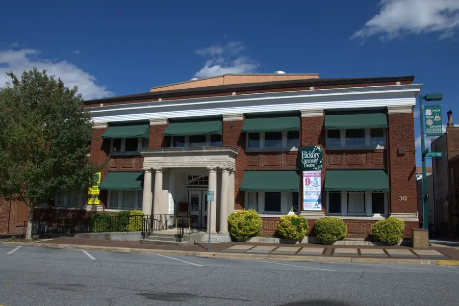 Neoclassical brick facade and entrance columns of the Hickory Municipal Building in downtown Hickory