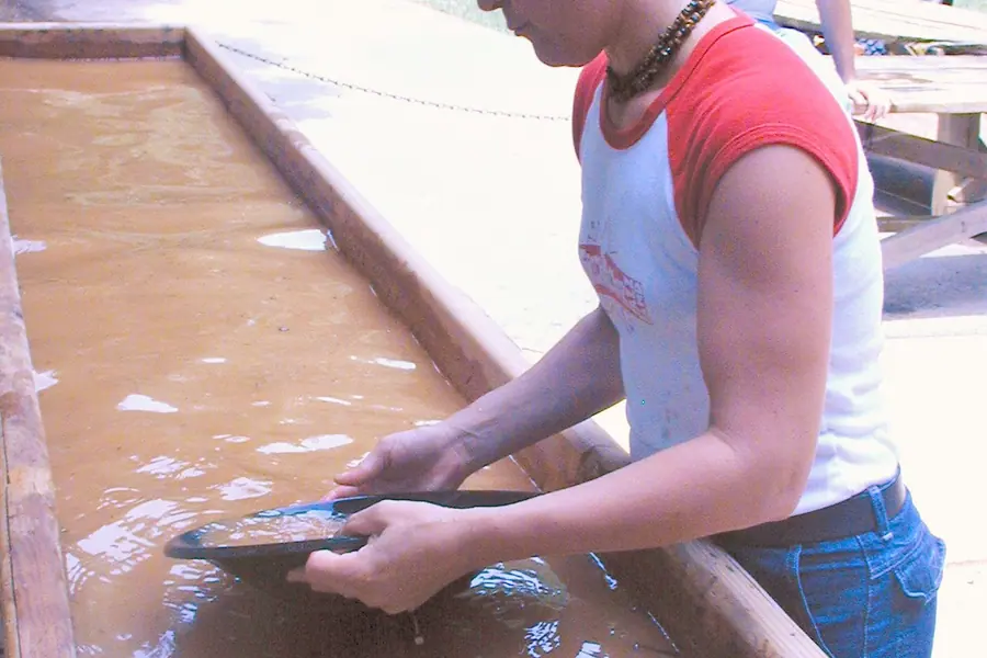 Demonstration of traditional gold panning technique at Reed Gold Mine in Midland