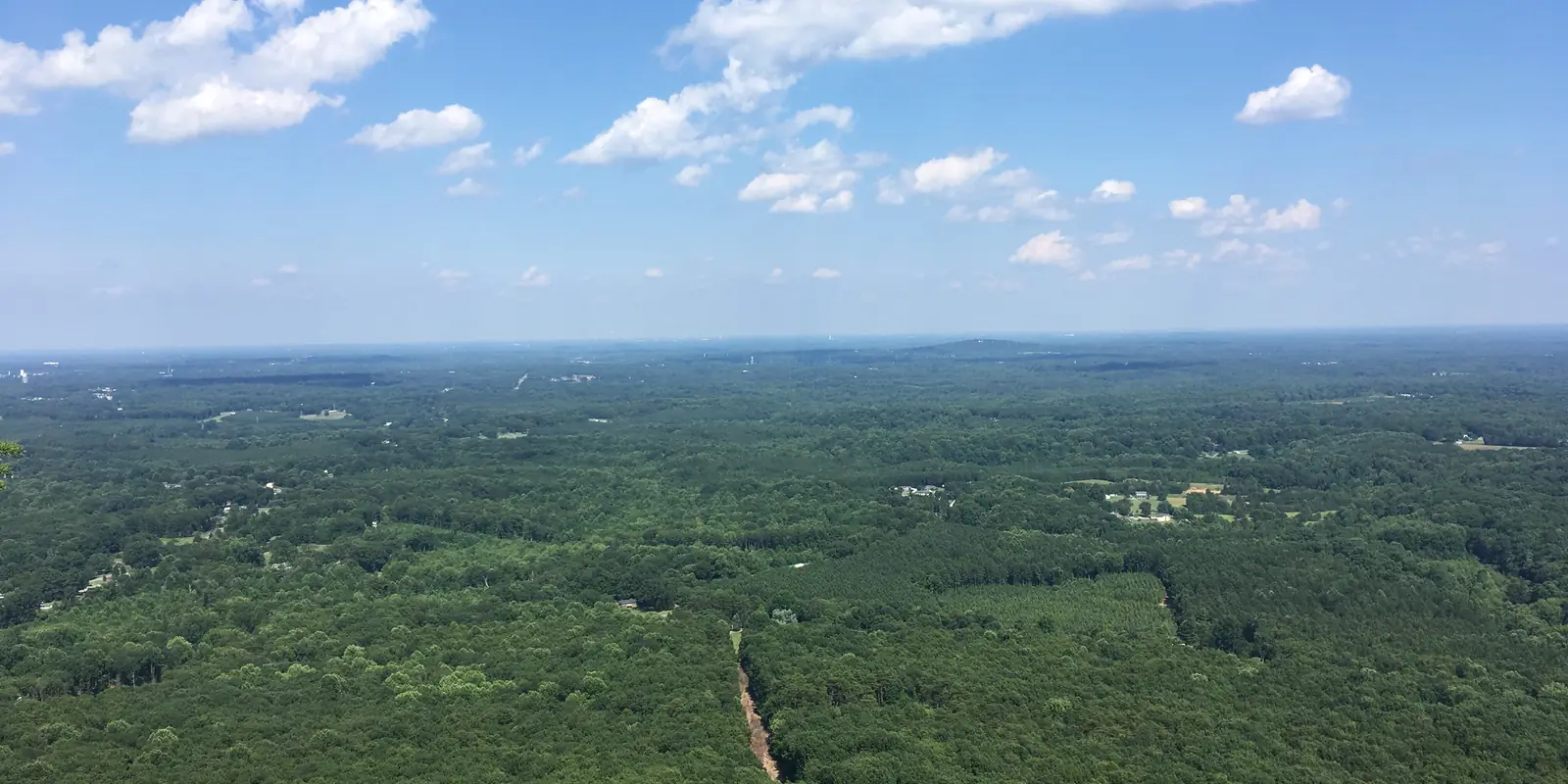 Panoramic view east toward the Charlotte skyline from the summit of Crowders Mountain in Gaston County