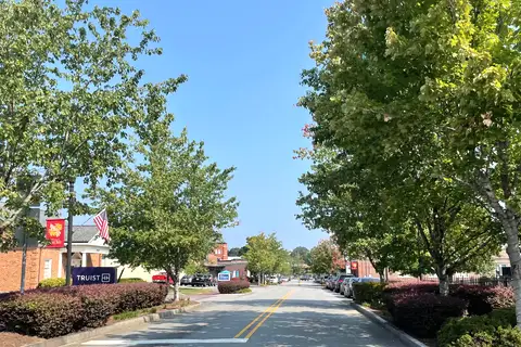 Historic brick storefronts and walkable streetscape of downtown Mount Holly, North Carolina