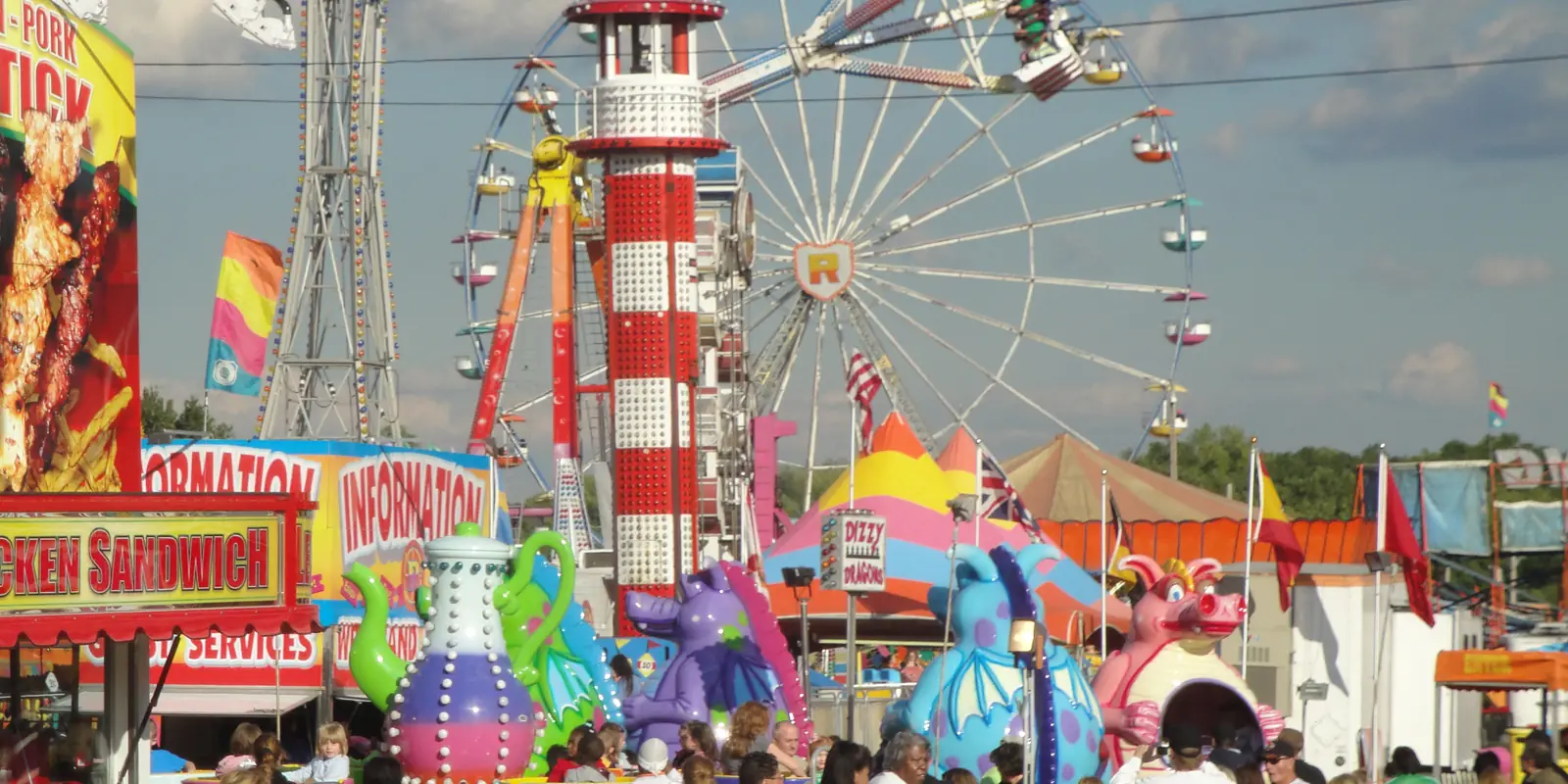 Ferris wheel and colorful carnival midway attractions at the historic Cleveland County Fair in Shelby, North Carolina