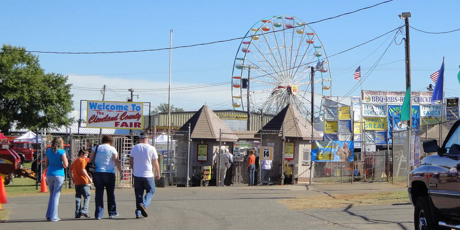 Fairgrounds entrance gate and Carolina barbecue signs at the Cleveland County Fair in Shelby, North Carolina