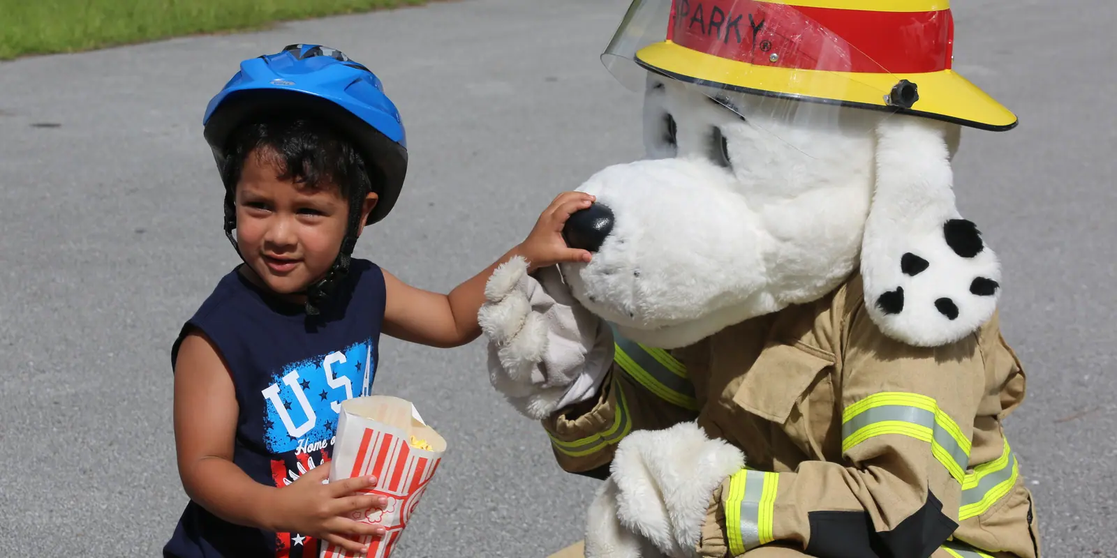 Families and children celebrating community spirit at a vibrant Independence Day parade