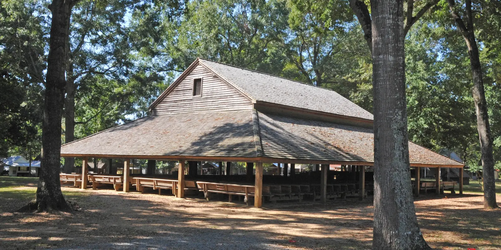 Historic open-air wooden arbor structure at Pleasant Grove Camp Meeting Ground dating to 1830 in Union County