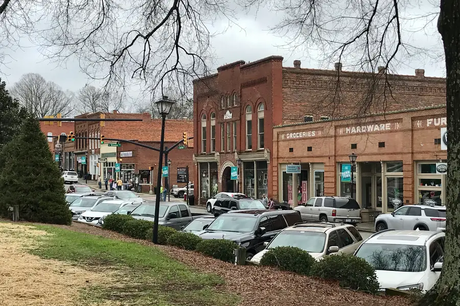 Brick commercial buildings and retail boutiques along South Main Street in downtown Waxhaw, North Carolina