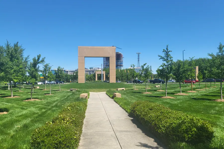 Grand brick entrance arches and manicured landscaping at Ballantyne Commons Parkway near the Weddington border