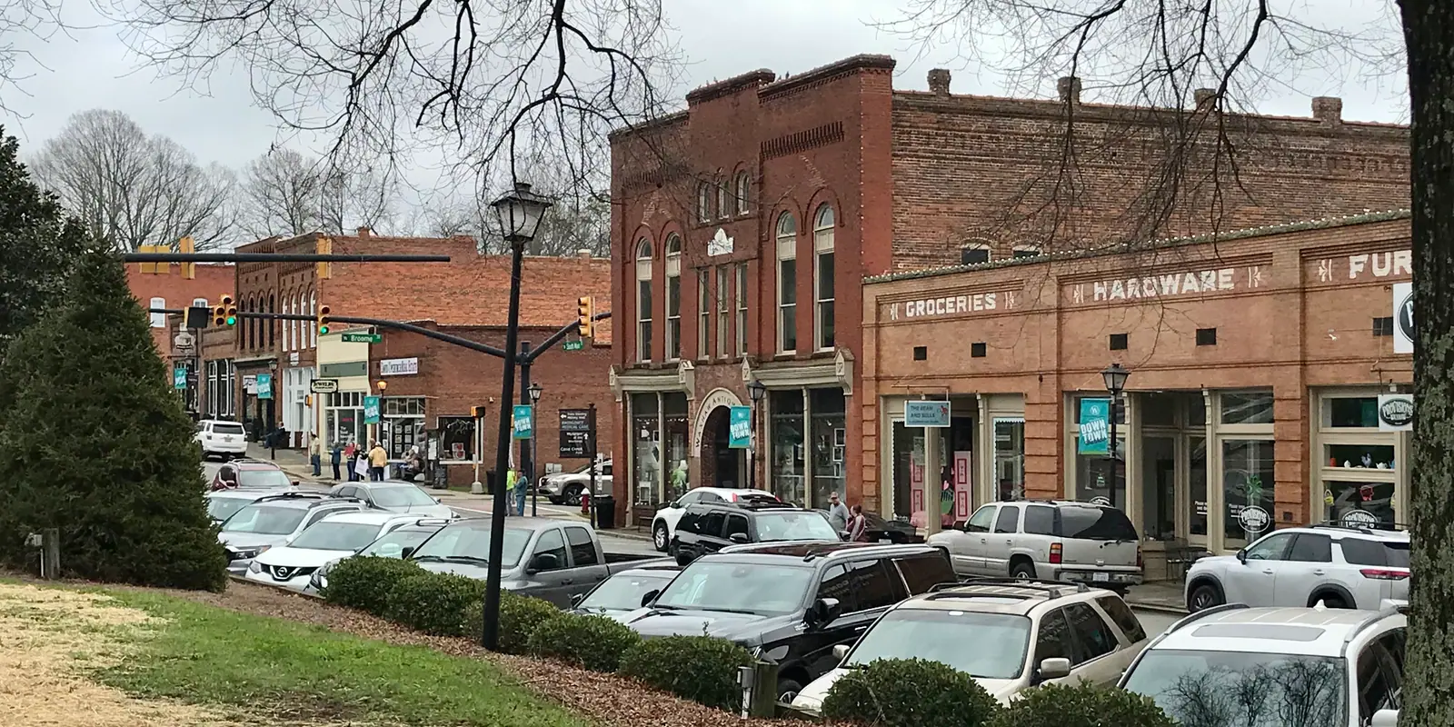 Historic Carolina district storefronts and community gathering during annual heritage festival