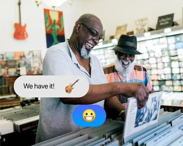 Owners of a local record shop helping a customer, with a We have it chat bubble