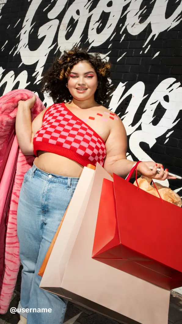 Smiling shopper carrying shopping bags, shown as a TikTok Shop video ad