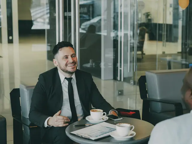 Advisor smiling during a meeting with a client in a bright office